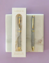 Idlewild Co. Grid Ballpoint Luxe Pen with sleek design and metallic finish, perfect for writing and everyday use.