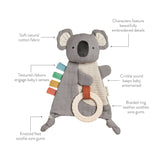 Itzy Ritzy Bitzy Crinkle Sensory Toy with Teether in Dino design, soft fabric with crinkle textures and attached teething elements.