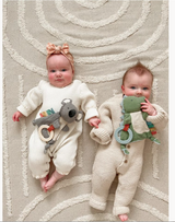 Itzy Ritzy Bitzy Crinkle Sensory Toy with Teether in Dino shape, featuring crinkle fabric and soft teething surface for babies.