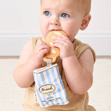 Itzy Ritzy Baguette Teensy Crinkle bag with crinkled fabric and sleek design, perfect for stylish everyday use.