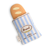 Itzy Ritzy Baguette Teensy Crinkle diaper bag in crinkled fabric with adjustable straps and compact design.