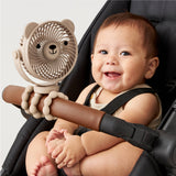 Itzy Breeze 3-Speed Stroller Fan by Itzy Ritzy, shown attached to a stroller, with adjustable fan blades and control buttons.