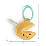 Itzy Ritzy Itzy Treat fortune cookie teether in soft silicone with a textured surface for baby teething comfort.