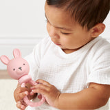 Pink Bunny Sweetie Rattle by Itzy Ritzy, soft baby toy with a plush bunny design and gentle rattling sound.
