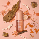 KITSCH Amber Shores Hair Perfume bottle with a sleek design and floral accents, showcasing the luxurious hair fragrance.