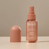 KITSCH Amber Shores Hair Perfume bottle with a sleek design and amber-colored liquid inside.