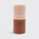 Set of 20 blush eco-friendly nylon hair elastics by KITSCH, shown bundled with smooth, stretchy elastic bands for hair styling.