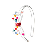 Rainbow Dots Big Bow Headband by Lilies & Roses NY featuring a colorful polka dot pattern and a large decorative bow.
