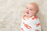Unisex Heads or Tails swaddle blanket by Little Hometown featuring playful patterns on soft, cozy fabric for babies.