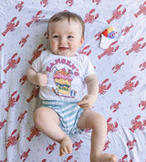 Unisex Heads or Tails swaddle blanket by Little Hometown featuring playful, neutral design for babies and toddlers.