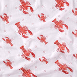 Unisex Heads or Tails swaddle blanket by Little Hometown featuring playful game-inspired print on soft fabric.
