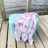 Unisex Heads or Tails swaddle blanket by Little Hometown with playful pattern, soft fabric, suitable for newborns and infants.