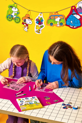 OOLY x Peanuts DIY Shrink Art Kit with colorful supplies and Peanuts character designs for creative shrink plastic projects.