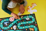 Petit Collage Catventures Board Game featuring colorful illustrated cat characters and game components on a vibrant play surface.