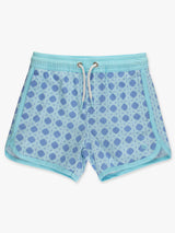 Boys periwinkle blue coastal cane swim trunks with dolphin hem, performance hybrid design by RuffleButts + RuggedButts.