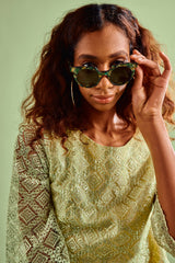SARDINE Aster Abalone Rizz sunglasses with rounded frames and abalone shell accents on the temples.
