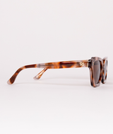 Sardine Demi Bella Vista sunglasses with rounded frames and dark tinted lenses on a white background.