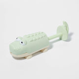 Pastel green crocodile water squirters by Sunnylife, featuring playful, soft-colored plastic design for outdoor water play.