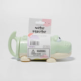 Pastel green crocodile-shaped water squirter by Sunnylife, colorful toy for kids' outdoor water play.