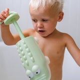 Pastel green crocodile-shaped water squirter by Sunnylife, designed for fun outdoor summer water play.