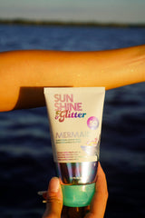Sunshine & Glitter Mermaid Biodegradable Glitter SPF 50 tube showing colorful, eco-friendly glitter product for skin protection.