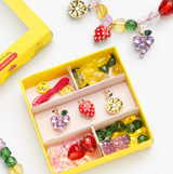 Super Smalls Make It Fruity Mini Bead Kit with colorful beads and accessories for creative jewelry making.