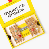 Super Smalls Super Stack Bracelet Set featuring colorful, layered bracelets with beads and charms, perfect for stacking or layering.