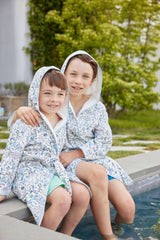 Timo & Violet Coral Reef bathrobe for children, size 1-2 years, featuring colorful coral reef pattern on soft fabric.