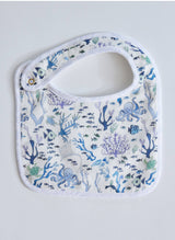 Timo & Violet Coral Reef Bib in vibrant multi-color design, featuring ocean-inspired coral reef patterns for babies.