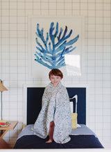 Colorful Coral Reef Shawl Blanket by Timo & Violet, showcasing vibrant, woven fabric with intricate coral reef patterns.