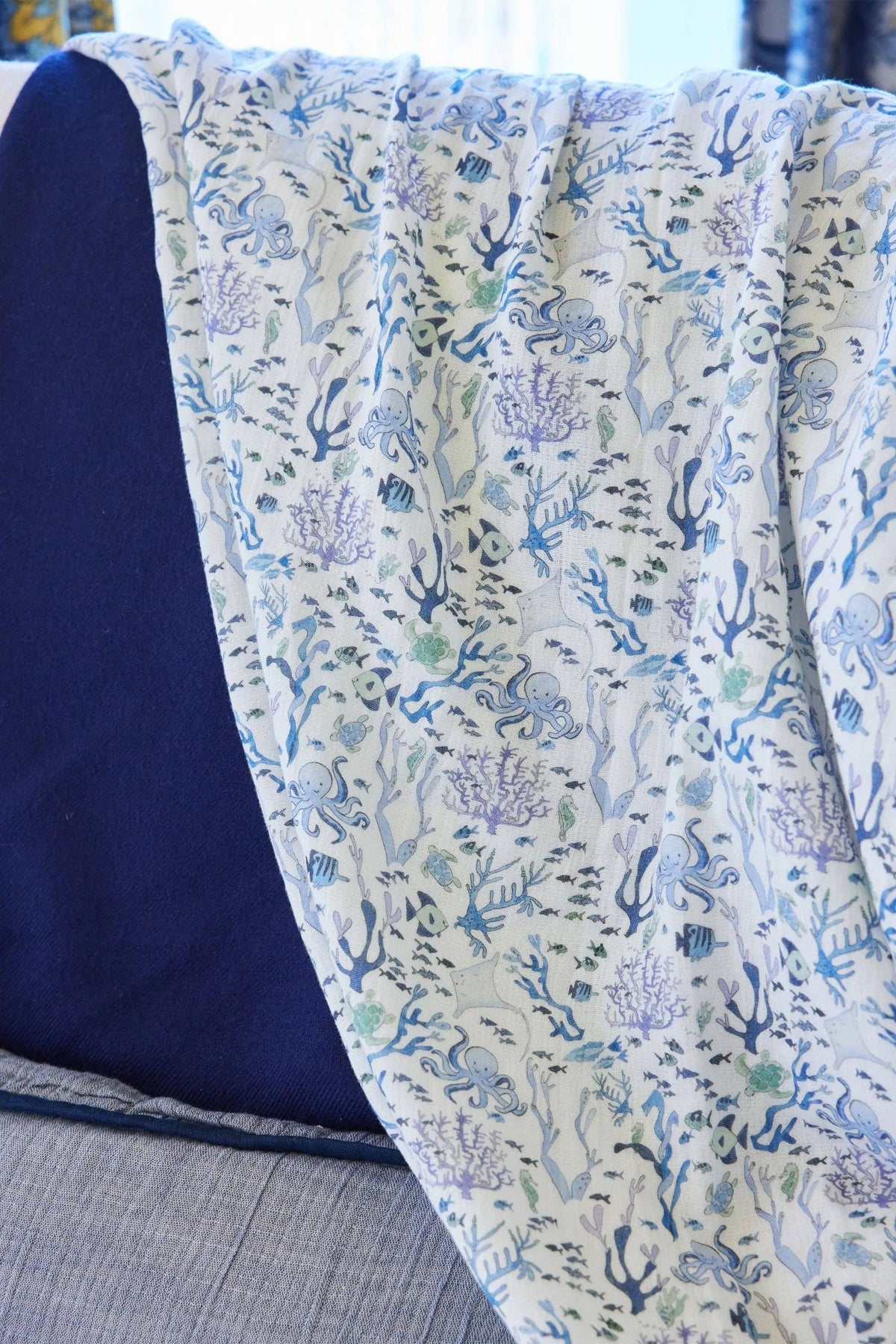 Colorful Coral Reef Shawl Blanket by Timo & Violet featuring vibrant, ocean-inspired patterns and soft, cozy fabric.