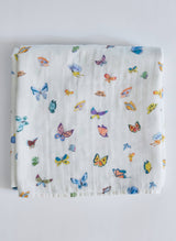 Timo & Violet Madame Butterfly Shawl Blanket in vibrant multi-colored fabric, draped to showcase its soft, cozy texture.