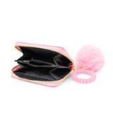 Pink 3D Bow Pom Pom Zip Wallet by Tiny Treats and ZOMI GEMS featuring a playful bow design and fluffy pom pom detail.