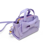 Purple Big Bow Baguette Handbag by Tiny Treats and ZOMI GEMS, featuring a stylish bow design and compact baguette shape.