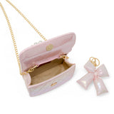 Purple shiny quilted fluffy bow handbag by Tiny Treats and ZOMI GEMS, featuring a soft textured surface and decorative bow detail.