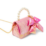 Shiny purple quilted fluffy bow handbag by Tiny Treats and ZOMI GEMS, featuring a plush design and decorative bow detail.