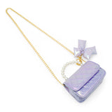 Purple shiny quilted fluffy bow handbag by Tiny Treats and ZOMI GEMS, showcasing a stylish and soft accessory with a decorative bow.