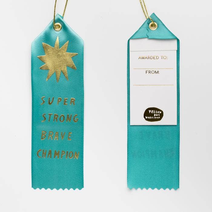 Yellow Owl Workshop Brave Champ Award Ribbon with yellow and white design, featuring a decorative badge for recognition.